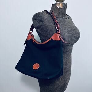Dooney & Bourke black with brown leather trim shoulder purse